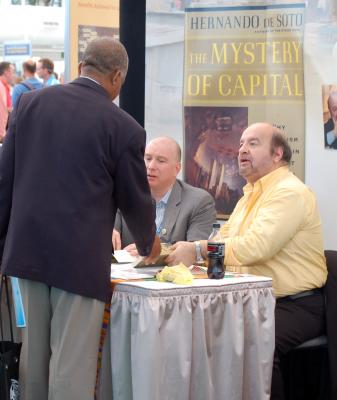 Hernando De Soto signing copies of his book